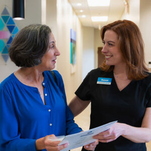 A doctor discusses cataract surgery with a patient in Orlando.