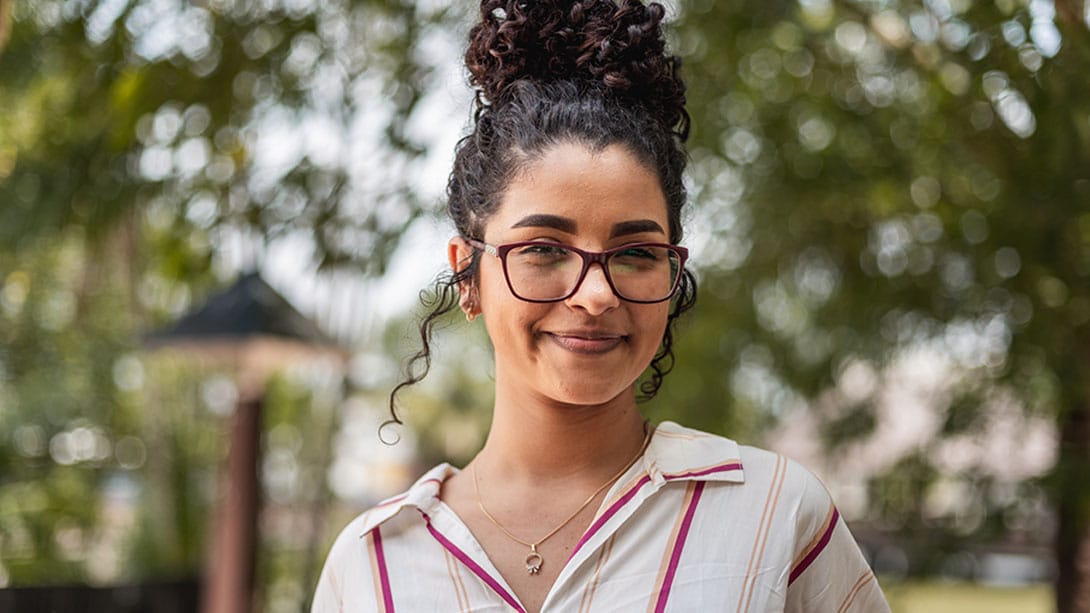 woman with glasses before getting lens replacement surgery in Orlando, FL