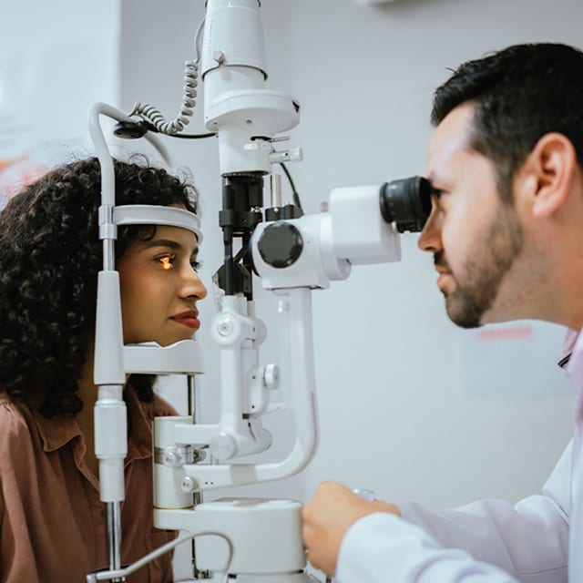 A provider evaluates a patient's eyes for EVO ICL in Clermont, FL.